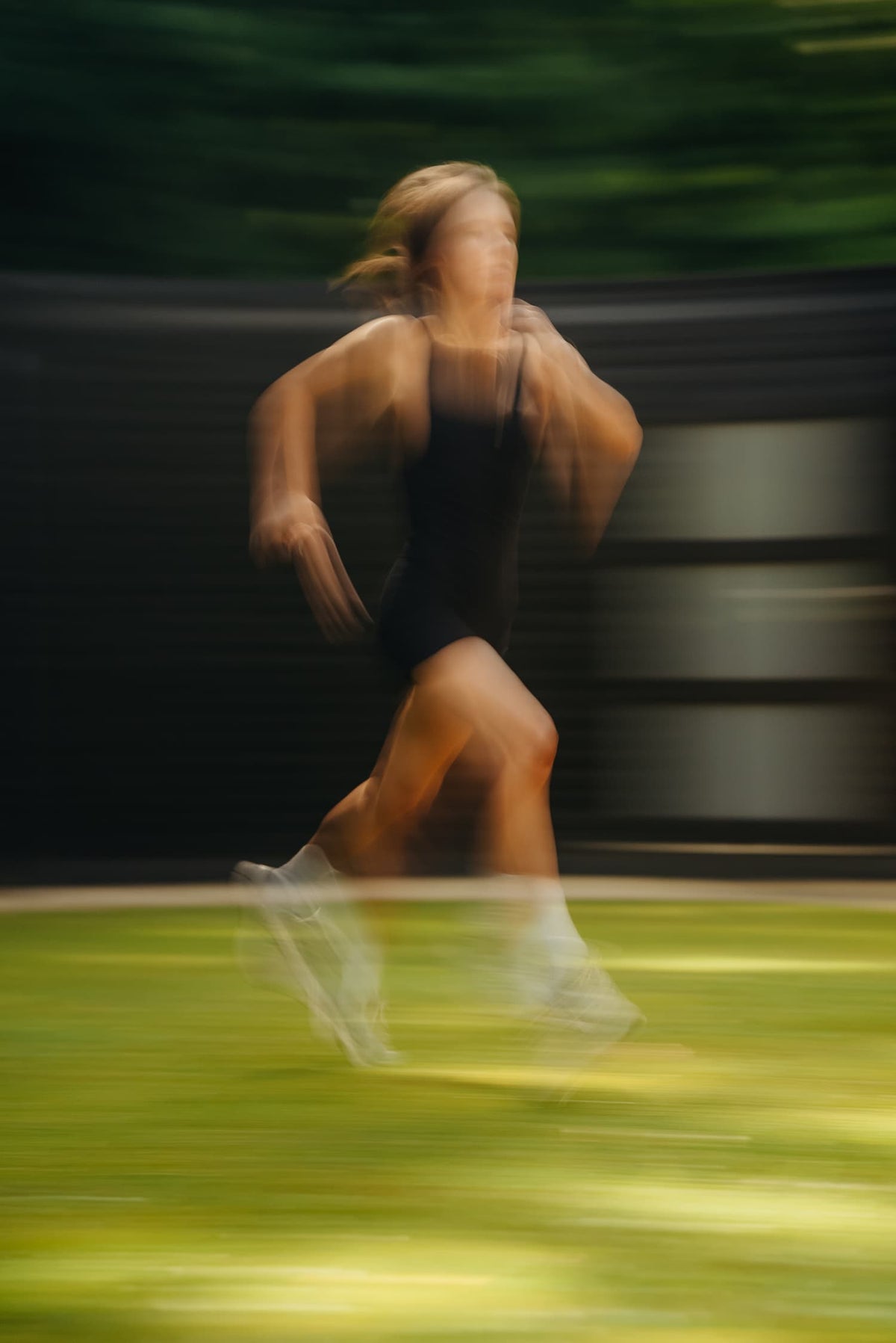 Sophie Cambron, founder of Odakare, mid-run, photographed with a motion blur effect against a green background